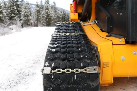 tracks or chains on skid steer|skid loader chains.